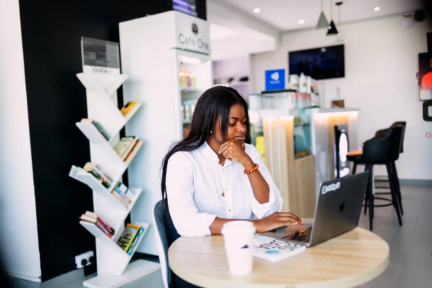 Nigerian professional reviewing resources on her laptop in Lagos